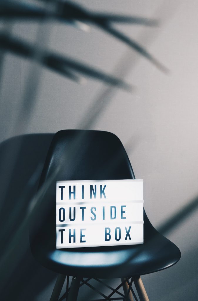 chair with sign stating "think outside the box"