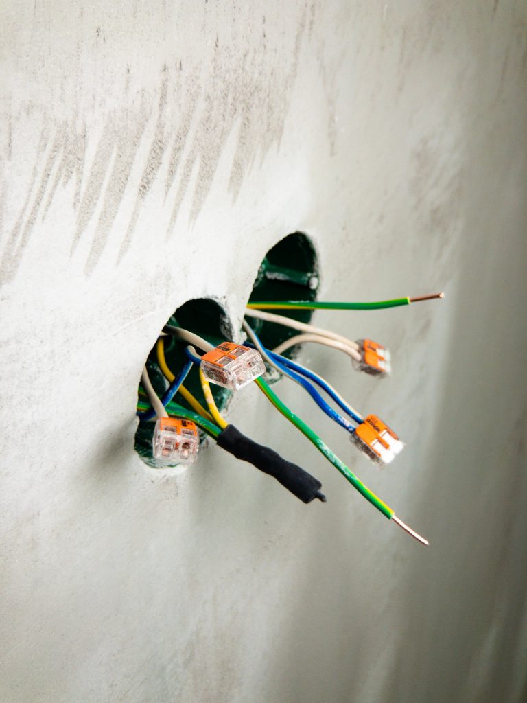 Electrical wires poking out of wall